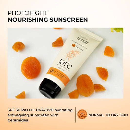 Nourishing sunscreen tube with apricot pieces on a light background