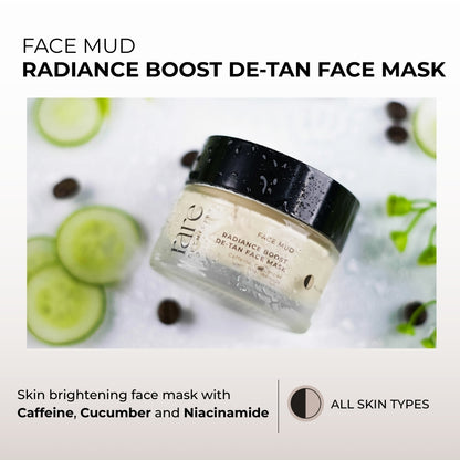 Radiance Boost De-Tan Face Mask jar with cucumber slices and coffee beans on a white background