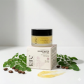 Jar of blemish rescue night gel with packaging and leaves on a white background