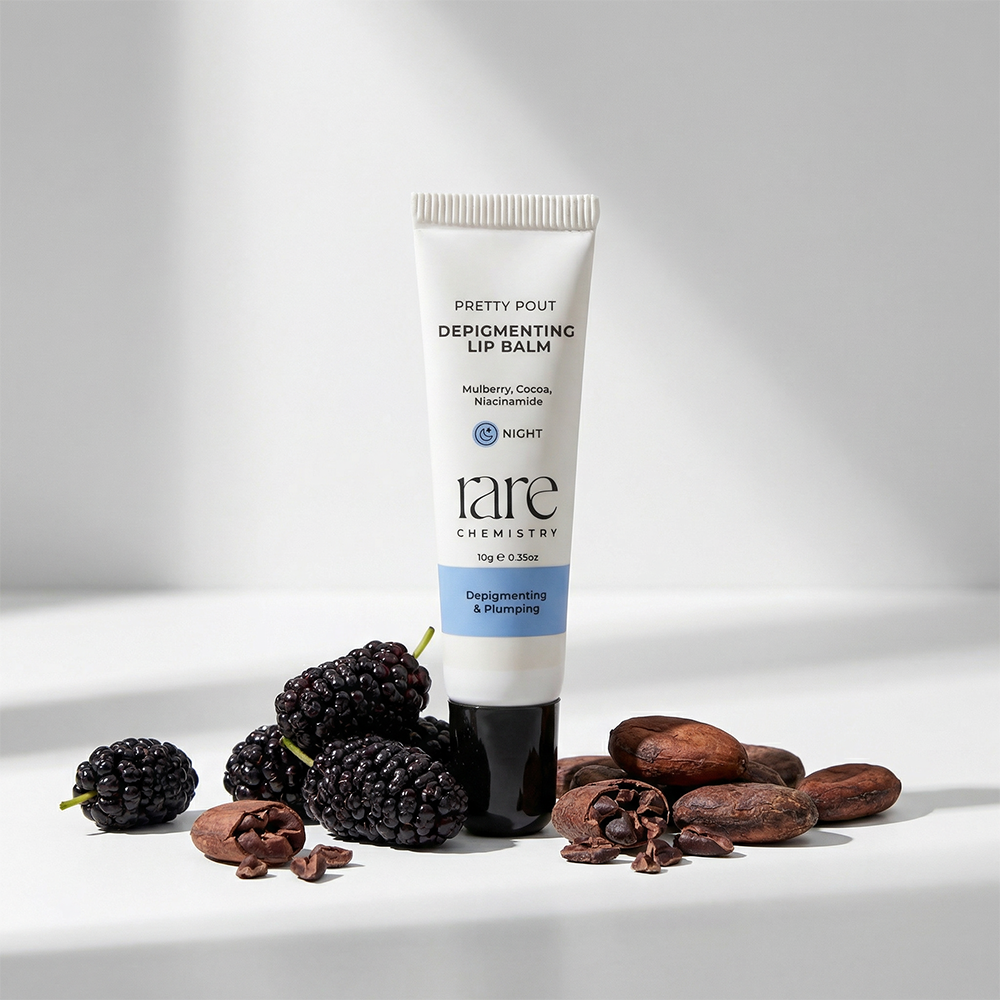 Tube of 'rare chemistry' lip balm with mulberries and cocoa beans on a white background