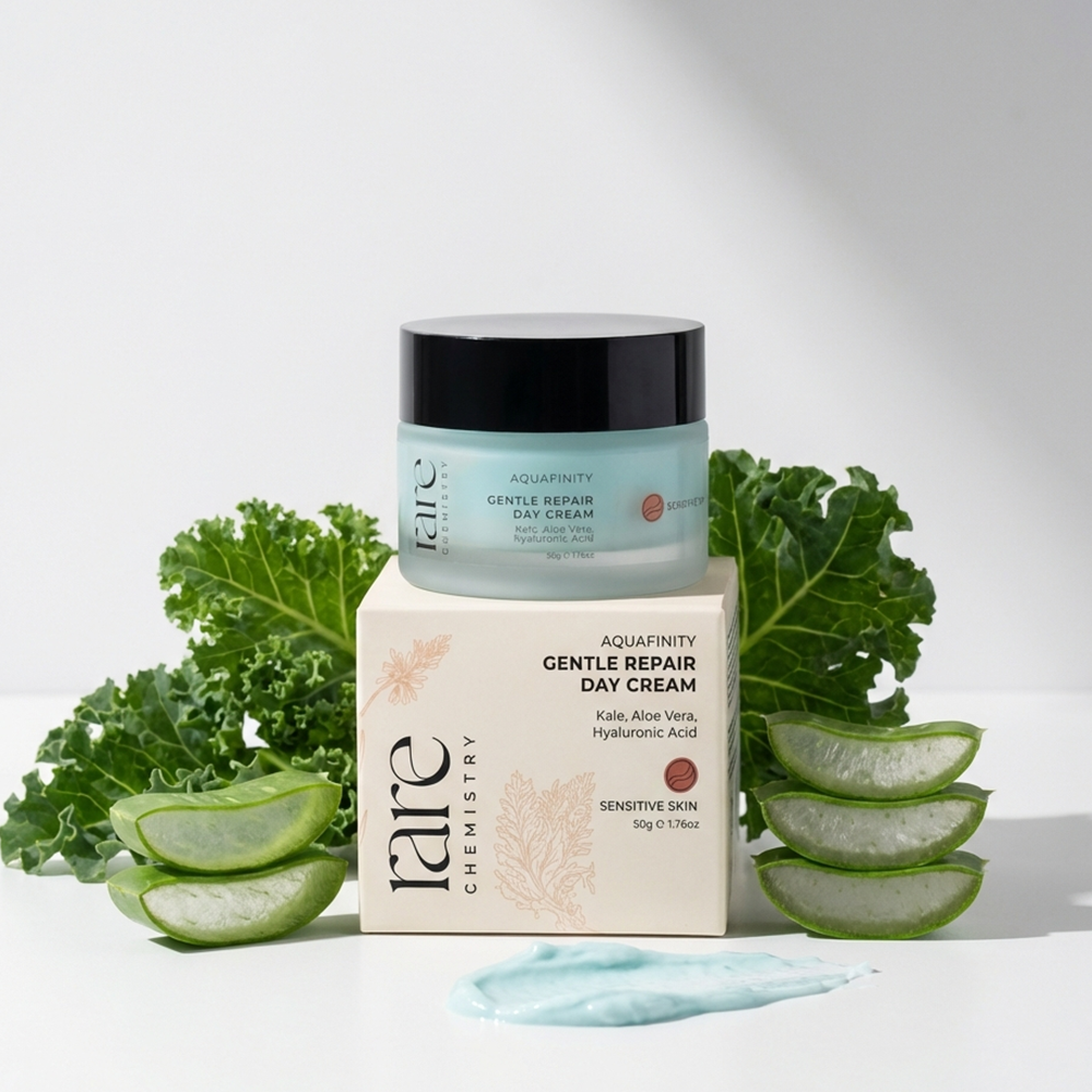 Jar of 'Aqua' Gentle Repair Day Cream with packaging and aloe vera slices on a white background
