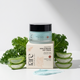 Jar of 'Aqua' Gentle Repair Day Cream with packaging and aloe vera slices on a white background