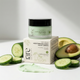 Moisture balance night cream with packaging, avocado, and cucumber on a light background