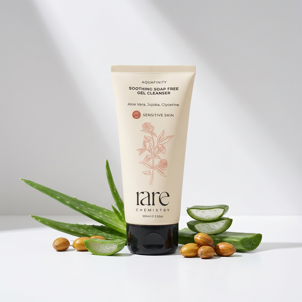 Tube of 'rare chemistry soothing soap free gel cleanser with aloe vera leaves and nuts on a light background