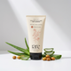 Tube of 'rare chemistry soothing soap free gel cleanser with aloe vera leaves and nuts on a light background