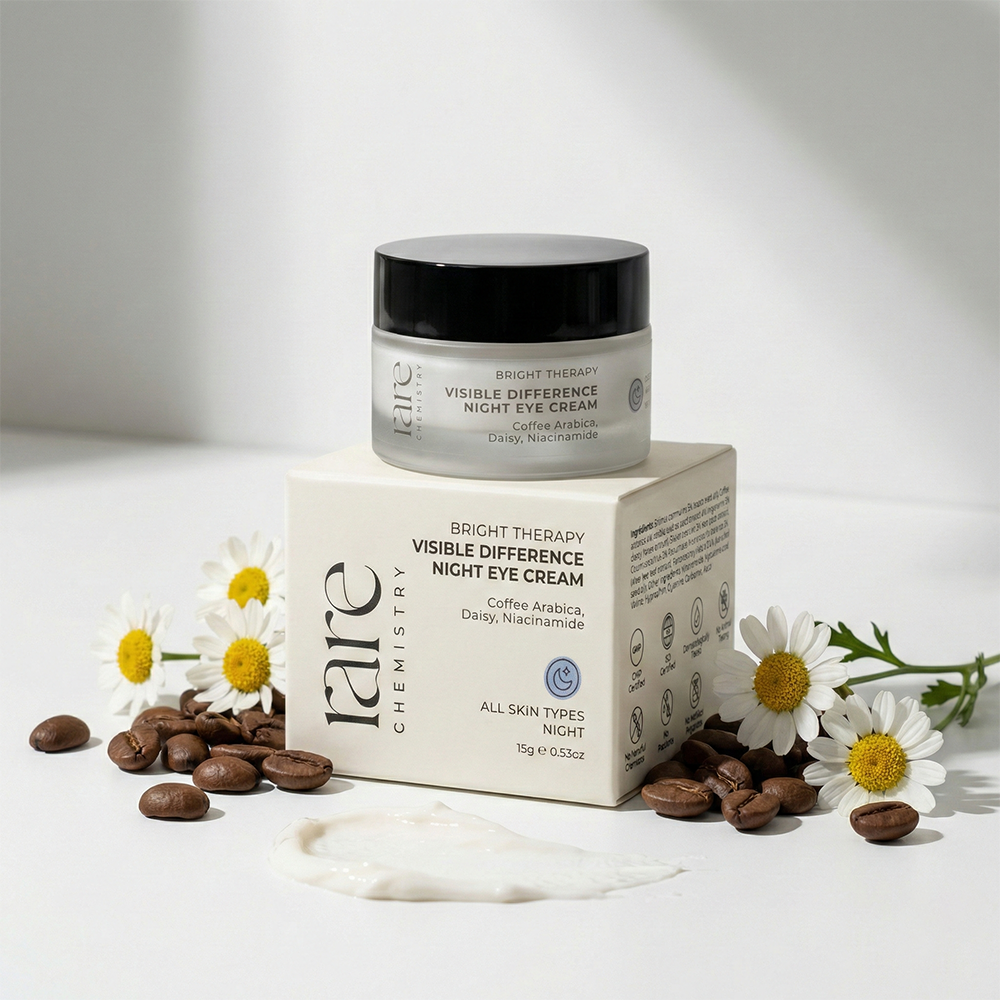 Jar of cream and its packaging with coffee beans and daisies on a light background