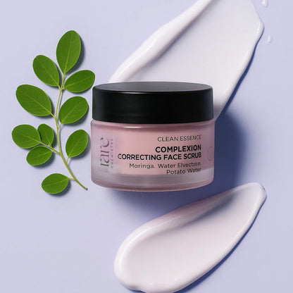 Jar of 'Clean Essence Complexion Correcting Face Scrub' with green leaves on a light purple background