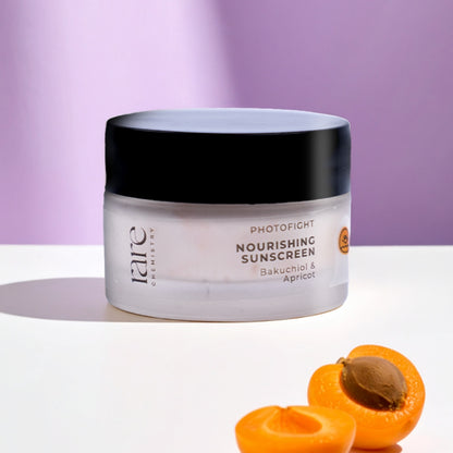 Jar of Tarte Nourishing Sunscreen with apricots on a purple background
