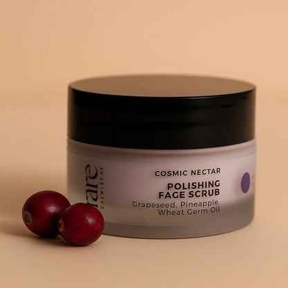 Cosmetic jar of 'Cosmic Nectar Polishing Face Scrub' with cranberries on a beige background