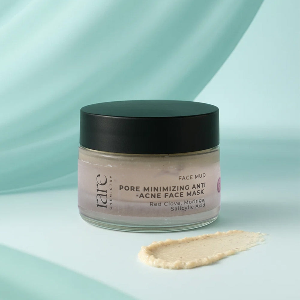 Jar of 'rare chemistry' face mud pore minimizing anti acne face mask on a light blue background
